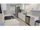 Bright kitchen featuring stainless steel appliances, granite countertops, and ample cabinet space at 1500 Ohio Ne Ave, St Petersburg, FL 33703