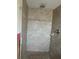 Modern tiled shower with sleek fixtures and a minimalist design, creating a spa-like experience at 1500 Ohio Ne Ave, St Petersburg, FL 33703
