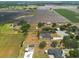 Drone shot of residences with spacious yards, mature trees, and neighborhood planning at 1521 Avondale Ridge Dr, Plant City, FL 33567
