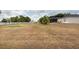 A large backyard with a white fence that offers endless possibilities at 1521 Avondale Ridge Dr, Plant City, FL 33567
