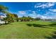 Extensive backyard with lush greenery and mature trees offering privacy and tranquility at 1521 Avondale Ridge Dr, Plant City, FL 33567