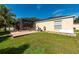 Exterior of the home showing the large screened lanai and spacious backyard at 1521 Avondale Ridge Dr, Plant City, FL 33567