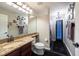 Bathroom featuring granite countertops, a large mirror, and a shower with a curtain at 1521 Avondale Ridge Dr, Plant City, FL 33567