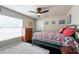 Charming bedroom with a quilt bedspread, a ceiling fan, and a bright window at 1521 Avondale Ridge Dr, Plant City, FL 33567