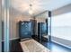 Bedroom featuring dark floors, large closet with mirrored doors, and chandelier lighting at 1521 Avondale Ridge Dr, Plant City, FL 33567