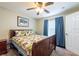 Bedroom featuring a ceiling fan, a double bed, and curtains at 1521 Avondale Ridge Dr, Plant City, FL 33567