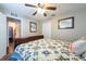 Bedroom featuring a ceiling fan, a double bed, and a closet at 1521 Avondale Ridge Dr, Plant City, FL 33567