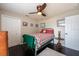 Comfortable bedroom featuring a ceiling fan, a quilt bedspread, and natural lighting at 1521 Avondale Ridge Dr, Plant City, FL 33567