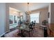Dining room with a chandelier and glass table at 1521 Avondale Ridge Dr, Plant City, FL 33567