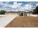 Charming single-story home with well-manicured lawn, three-car garage, and a welcoming entrance at 1521 Avondale Ridge Dr, Plant City, FL 33567
