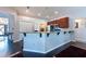 Kitchen featuring a breakfast bar with granite counters and dark wood cabinets, ideal for entertaining at 1521 Avondale Ridge Dr, Plant City, FL 33567