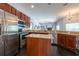 Open-concept kitchen boasting stainless steel appliances and granite countertops at 1521 Avondale Ridge Dr, Plant City, FL 33567