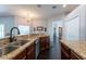 Beautiful kitchen with granite countertops, stainless steel appliances, and dark wood floors at 1521 Avondale Ridge Dr, Plant City, FL 33567