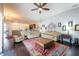 Inviting living room with wood floors, cozy seating, and an open layout ideal for entertaining at 1521 Avondale Ridge Dr, Plant City, FL 33567