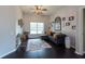 Cozy living room with dark wood floors, natural light, and comfortable seating at 1521 Avondale Ridge Dr, Plant City, FL 33567