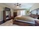 Inviting main bedroom featuring a television, closet, and a decorative rug at 1521 Avondale Ridge Dr, Plant City, FL 33567