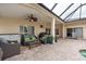 The covered lanai with ceiling fan provides a comfortable space for outdoor entertaining with pool views at 1521 Avondale Ridge Dr, Plant City, FL 33567