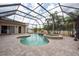 Spacious screened pool with spa offers a resort-style oasis, perfect for relaxing and entertaining at 1521 Avondale Ridge Dr, Plant City, FL 33567