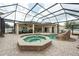 Enjoy the heated spa and gorgeous pool with rock waterfall in your own private backyard oasis at 1521 Avondale Ridge Dr, Plant City, FL 33567