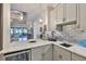 Wet bar with mini fridge and view into living space at 15303 Valencia Del Sol St, Wimauma, FL 33598