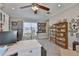 Cozy home office with a carousel horse in the corner by a large window at 15303 Valencia Del Sol St, Wimauma, FL 33598