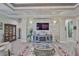 Elegant living room with stone accent wall, fireplace, and beautifully coordinated decor at 15303 Valencia Del Sol St, Wimauma, FL 33598