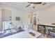 This well-lit studio features a sewing machine and art supplies for all types of projects at 15303 Valencia Del Sol St, Wimauma, FL 33598