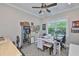 Bright, sunlit artist's studio with an assortment of crafting and art materials at 15303 Valencia Del Sol St, Wimauma, FL 33598