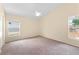 Spacious bedroom with neutral color palette, carpet flooring, and natural light at 1654 Portsmouth Lake Dr, Brandon, FL 33511
