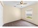 Comfortable bedroom with carpeted floors and ample natural light from the window at 1654 Portsmouth Lake Dr, Brandon, FL 33511