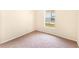 Cozy bedroom with neutral carpet and a window view to the outdoors at 1654 Portsmouth Lake Dr, Brandon, FL 33511