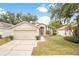 Charming single-story home featuring a two-car garage and well-maintained front yard landscaping at 1654 Portsmouth Lake Dr, Brandon, FL 33511