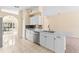 Updated kitchen featuring stone backsplash, stainless dishwasher, and marble countertops at 1654 Portsmouth Lake Dr, Brandon, FL 33511