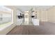 Bright eat-in kitchen featuring stainless steel appliances, white cabinetry, and sleek countertop at 1654 Portsmouth Lake Dr, Brandon, FL 33511