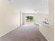 Open floor plan with sliding glass doors, marble countertops, and a cozy fireplace at 1654 Portsmouth Lake Dr, Brandon, FL 33511
