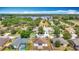 Aerial view of the home in its neighborhood near the lake at 19910 Wyndmill Cir, Odessa, FL 33556