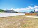 Wide shot of the spacious backyard and perimeter fence at 19910 Wyndmill Cir, Odessa, FL 33556
