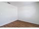 Minimalist bedroom with light walls, new flooring, and multiple electrical outlets at 19910 Wyndmill Cir, Odessa, FL 33556