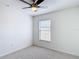 Bright bedroom featuring a ceiling fan, carpet, and a window with blinds at 19910 Wyndmill Cir, Odessa, FL 33556