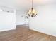 Bright and open living room with a decorative chandelier and views of other rooms at 19910 Wyndmill Cir, Odessa, FL 33556