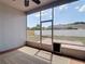 Enclosed patio with an exterior view of the fenced backyard and a convenient pet door at 19910 Wyndmill Cir, Odessa, FL 33556