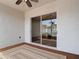 A covered patio with neutral rug, ceiling fan, and sliding glass doors providing outdoor access at 19910 Wyndmill Cir, Odessa, FL 33556