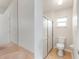 Small bathroom featuring a sink, toilet, and shower with sliding glass doors at 2015 W Del Webb Blvd, Sun City Center, FL 33573