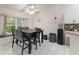 Eat-in kitchen with a modern light fixture, large window seat, and breakfast nook at 2015 W Del Webb Blvd, Sun City Center, FL 33573