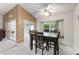 Dining area featuring a large table, chairs, and sliding doors leading to an outdoor area at 2015 W Del Webb Blvd, Sun City Center, FL 33573