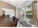 Dining area with a table, chairs, window seat, and a view of the backyard at 2015 W Del Webb Blvd, Sun City Center, FL 33573