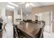 Open floor plan showcasing the kitchen, dining area, and living room with access to the outdoors at 2015 W Del Webb Blvd, Sun City Center, FL 33573