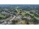 Aerial view of neighborhood homes near a lush golf course at 2219 Summit View Dr, Valrico, FL 33596