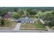 Aerial shot of home boasting a long driveway and a well-manicured lawn at 2219 Summit View Dr, Valrico, FL 33596
