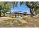 Large backyard with a screened pool and spacious green lawn at 2219 Summit View Dr, Valrico, FL 33596